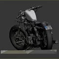 Classic Silver and Black Motorcycle with Large Tires on Brick Platform